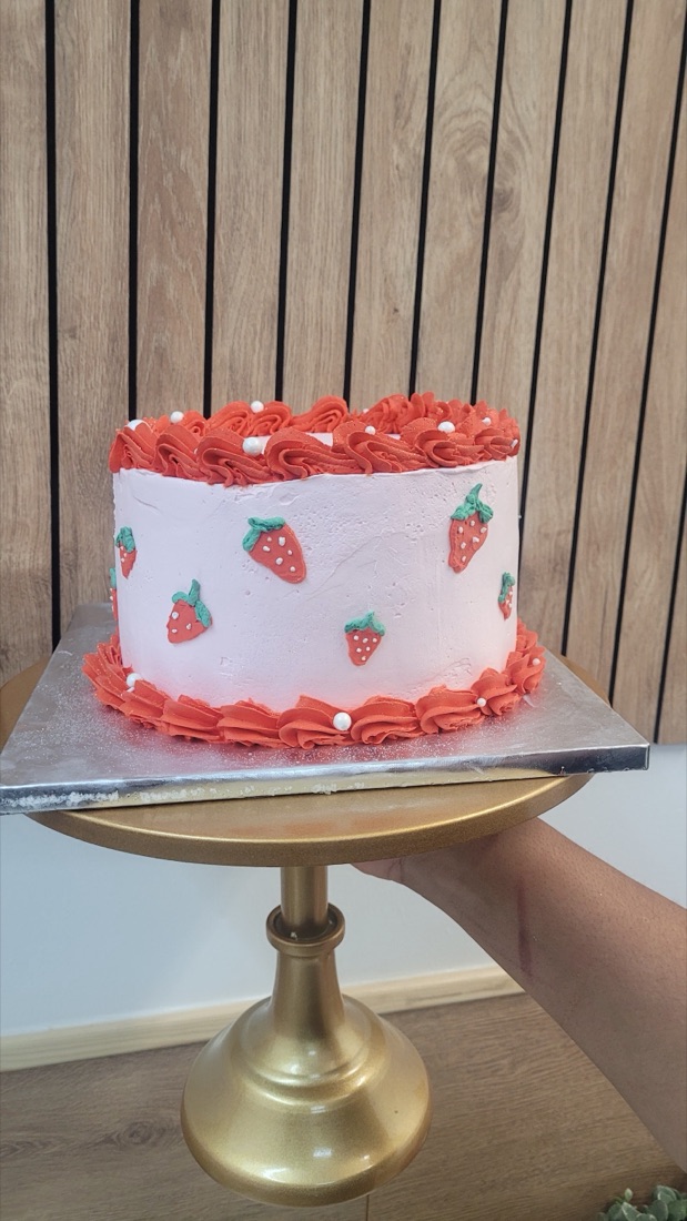 A pink strawberry-cream cake